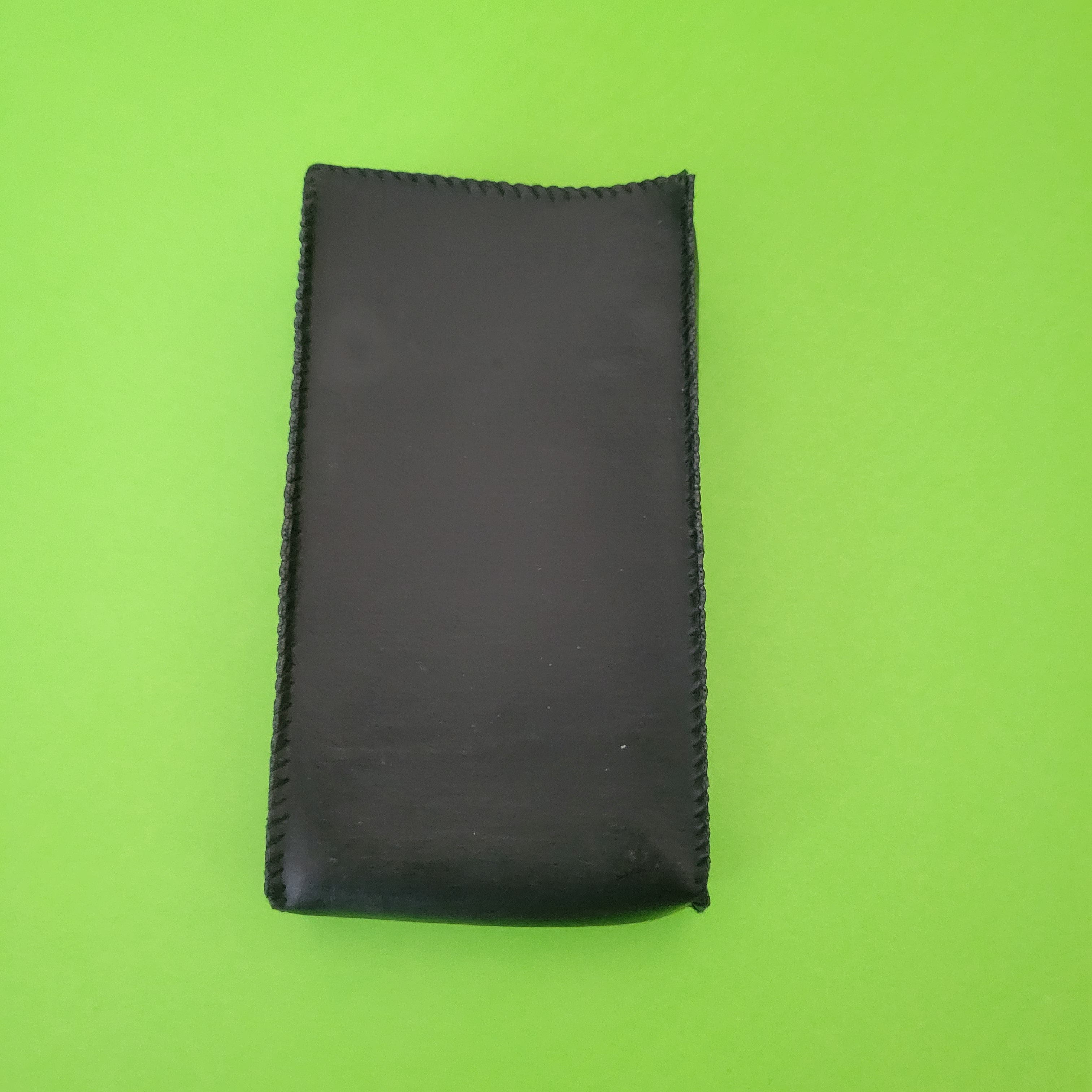An image of the case of a Microlith Four function plus calculator